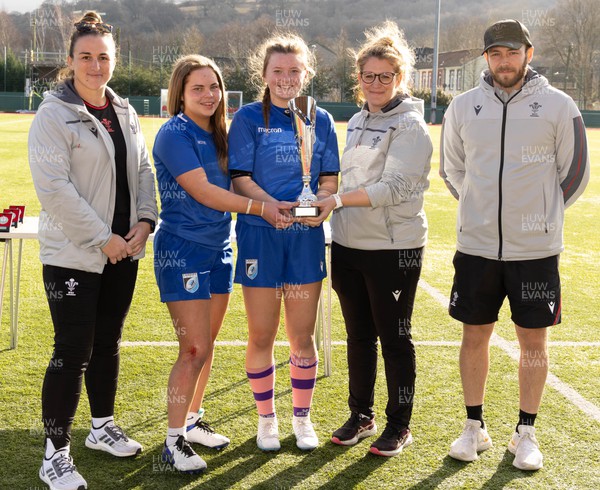 190223 - Scarlets U18 Women v Cardiff Rugby U18 Women, WRU Women’s U18 Age Grade Championship - Cardiff co-captains Riley Stanger and Katie Sims are presented with the WRU Women’s U18 Age Grade Championship Trophy by Catrina Nicholas-McLaughlin, Wales U18 Women head coach, along with Siwan Lillicrap, Performance Pathway Manager and coach (women), and Oliver Wilson, Wales U18 Women assistant coach