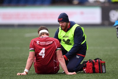 230225 - Scarlets U18s v Dragons U18s - Regional Age-Grade Championship finals - Kai Jones of Scarlets U18s receives treatment