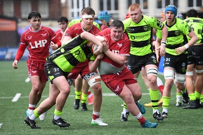 230225 - Scarlets U18s v Dragons U18s - Regional Age-Grade Championship finals - Teifi Thomas of Scarlets U18s is challenged for the ball