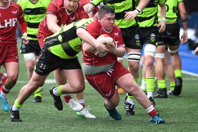 230225 - Scarlets U18s v Dragons U18s - Regional Age-Grade Championship finals - Teifi Thomas of Scarlets U18s is challenged for the ball