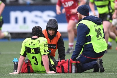 230225 - Scarlets U18s v Dragons U18s - Regional Age-Grade Championship finals - Max Woodward of Dragons U18s goes off the field injured