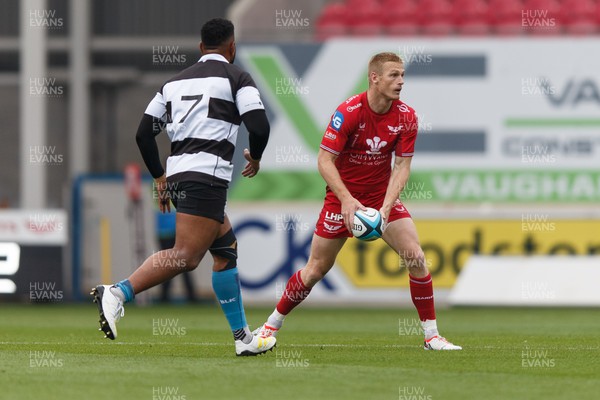 160923 - Scarlets v Barbarians - Phil Bennett Memorial Game - Johnny McNicholl of Scarlets passes the ball