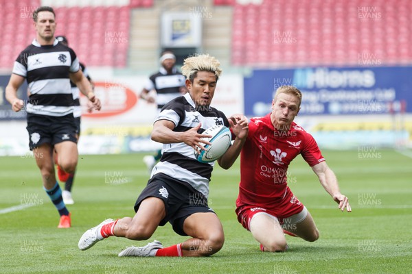 160923 - Scarlets v Barbarians - Phil Bennett Memorial Game - Johnny McNicholl of Scarlets puts pressure on Ryohey Yamanaka of Barbarians