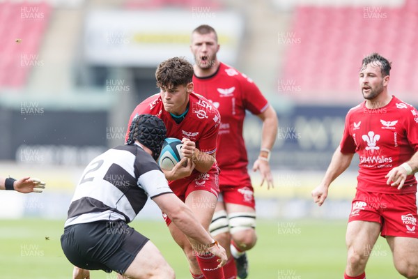 160923 - Scarlets v Barbarians - Phil Bennett Memorial Game - Eddie James of Scarlets takes on Lachlan Lonergan of Barbarians