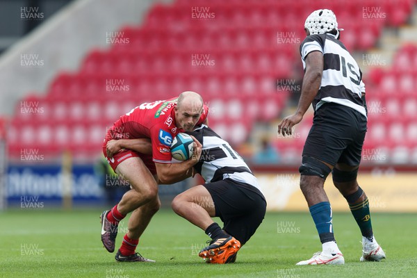 160923 - Scarlets v Barbarians - Phil Bennett Memorial Game - Ioan Nicholas of Scarlets is tackled by Shunta Nakamura of Barbarians