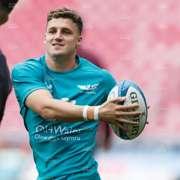 160923 - Scarlets v Barbarians - Phil Bennett Memorial Game - Tomi Lewis of Scarlets warms up ahead of the match