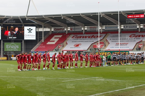 160923 - Scarlets v Barbarians - Phil Bennett Memorial Game - Players show their respect to Phil Bennett before kick off