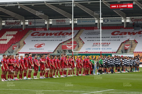 160923 - Scarlets v Barbarians - Phil Bennett Memorial Game - Players show their respect to Phil Bennett before kick off