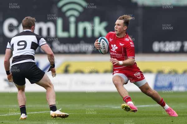 160923 - Scarlets v Barbarians - Phil Bennett Memorial Game - Ioan Lloyd of Scarlets looks for a gap