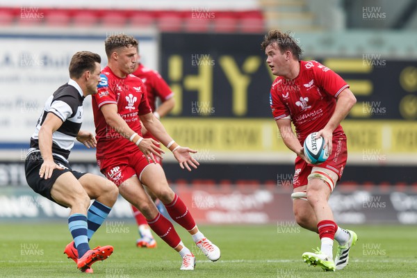 160923 - Scarlets v Barbarians - Phil Bennett Memorial Game - Iwan Shenton of Scarlets passes to Tomi Lewis