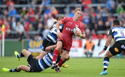 200816 - Scarlets v Bath - Preseason Friendly -Liam Williams of Scarlets is tackled by Rhys Priestland of Bath