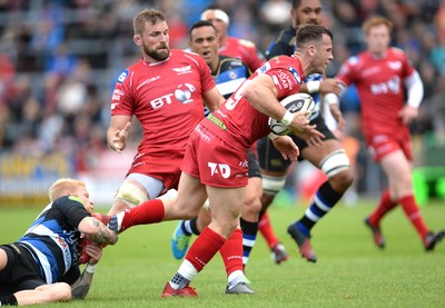 200816 - Scarlets v Bath - Preseason Friendly -Gareth Davies of Scarlets is tackled by Tom Homer of Bath