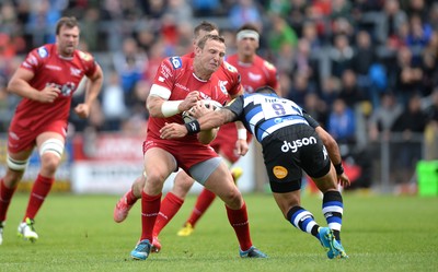 200816 - Scarlets v Bath - Preseason Friendly -Hadleigh Parkes of Scarlets is tackled by Kahn Fotuali’i of Bath