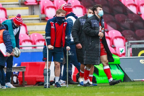 200221 - Scarlets v Benetton - Guinness PRO14 -   Sam Costelow of Scarlets on crutches at the end of the match