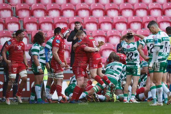 230324 - Scarlets v Benetton - United Rugby Championship - Scarlets players celebrate after scoring a try