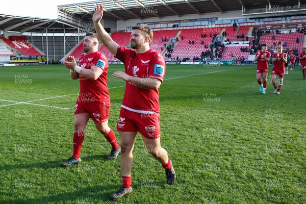 230324 - Scarlets v Benetton - United Rugby Championship - Wyn Jones and Shaun Evans of Scarlets show their appreciation to the crowd at the end of the match