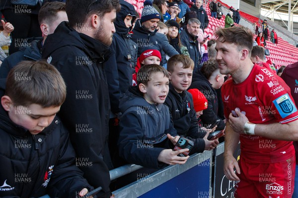 230324 - Scarlets v Benetton - United Rugby Championship - Ioan Lloyd of Scarlets with fans at the end of the match