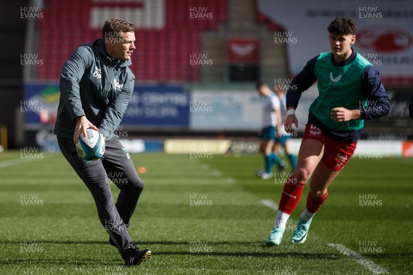 230324 - Scarlets v Benetton - United Rugby Championship - Scarlets head coach Dwayne Peel  and Eddie James during the warm up