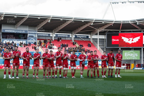 230324 - Scarlets v Benetton - United Rugby Championship - Scarlets applaud in memory of Lewis Jones, former Llanelli and Wales player, before the match