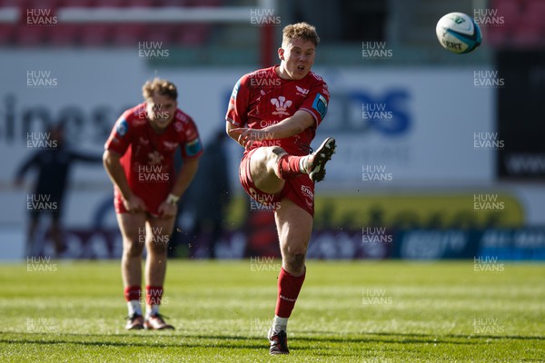 230324 - Scarlets v Benetton - United Rugby Championship - Sam Costelow of Scarlets kicks for touch