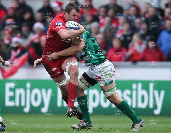 091217 - Scarlets v Benetton Rugby, European Champions Cup - David Bulbring of Scarlets is tackled by Marco Lazzaroni of Benetton Rugby as he charges forward