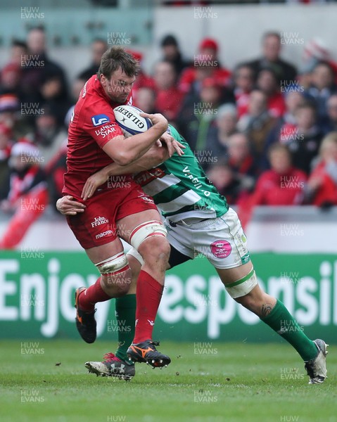 091217 - Scarlets v Benetton Rugby, European Champions Cup - David Bulbring of Scarlets is tackled by Marco Lazzaroni of Benetton Rugby as he charges forward
