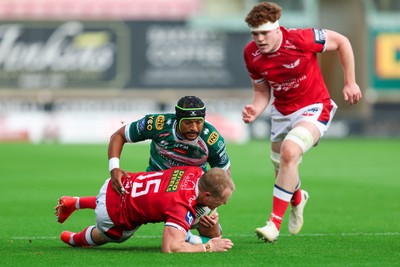 101026 - Scarlets v Benetton Rugby - United Rugby Championship - Blair Murray of Scarlets is tackled by Rhyno Smith of Benetton