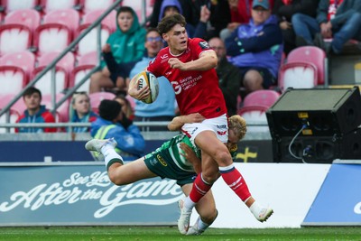 101026 - Scarlets v Benetton Rugby - United Rugby Championship - Eddie James of Scarlets is tackled by Louis Lynagh of Benetton