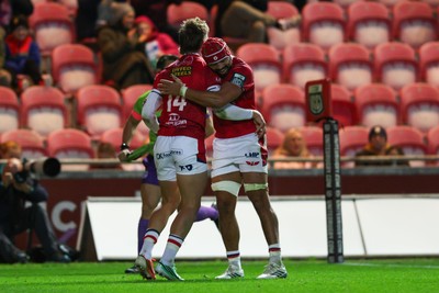 101026 - Scarlets v Benetton Rugby - United Rugby Championship - Ellis Mee of Scarlets is congratulated by Josh Macleod of Scarlets after scoring his second try