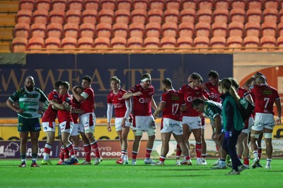 101026 - Scarlets v Benetton Rugby - United Rugby Championship - Scarlets players celebrate at the end of the match