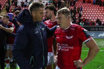 101026 - Scarlets v Benetton Rugby - United Rugby Championship - Sam Costelow of Scarlets and Gareth Anscombe at the end of the match