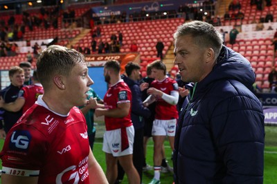 101026 - Scarlets v Benetton Rugby - United Rugby Championship - Sam Costelow of Scarlets and Gareth Anscombe at the end of the match