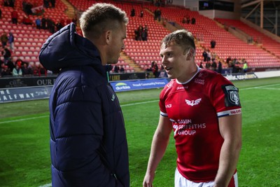 101026 - Scarlets v Benetton Rugby - United Rugby Championship - Sam Costelow of Scarlets and Gareth Anscombe at the end of the match
