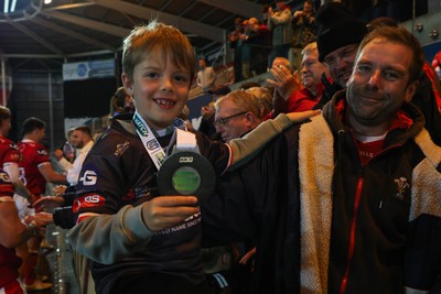 101026 - Scarlets v Benetton Rugby - United Rugby Championship - A young Scarlets fan with Blair Murray's Player of the Match medal