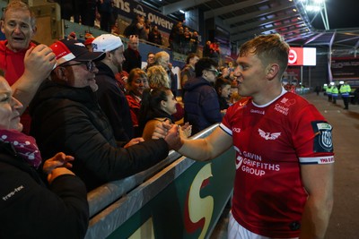 101026 - Scarlets v Benetton Rugby - United Rugby Championship - Sam Costelow of Scarlets with fans at the end of the match