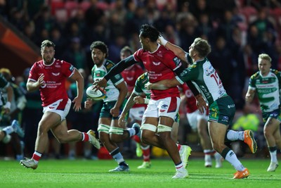 101026 - Scarlets v Benetton Rugby - United Rugby Championship - Sam Lousi of Scarlets offloads the ball