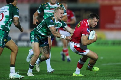 101026 - Scarlets v Benetton Rugby - United Rugby Championship - Gareth Davies of Scarlets is tackled by Louis Werchon of Benetton