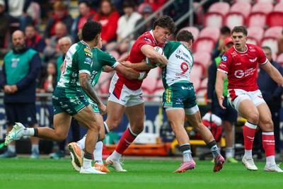 101026 - Scarlets v Benetton Rugby - United Rugby Championship - Eddie James of Scarlets is tackled by Alessandro Garbisi of Benetton