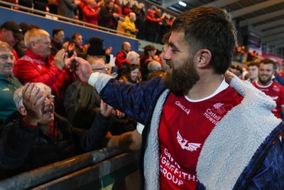 101026 - Scarlets v Benetton Rugby - United Rugby Championship - Kemsley Mathias of Scarlets with fans at the end of the match