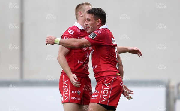 150918 - Scarlets v Benetton Rugby - Guinness PRO14 - Kieron Fonotia of Scarlets celebrates scoring a try with Johnny McNicholl