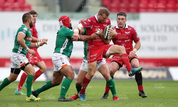 150918 - Scarlets v Benetton Rugby - Guinness PRO14 - Hadleigh Parkes of Scarlets is tackled by Hame Faiva of Benetton