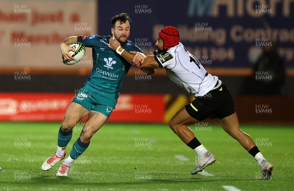 151223 - Scarlets v Black Lion - European Challenge Cup - Ryan Conbeer of Scarlets is tackled by Akaki Tabutsadze of Black Lions 