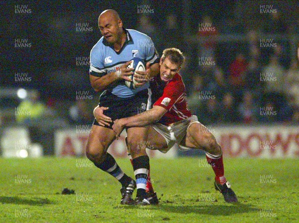 020106 - Llanelli Scarlets v Cardiff Blues - Celtic League -  Blues Jonah Lomu takes the high ball as Scarlets Dafydd James closes in to tackle