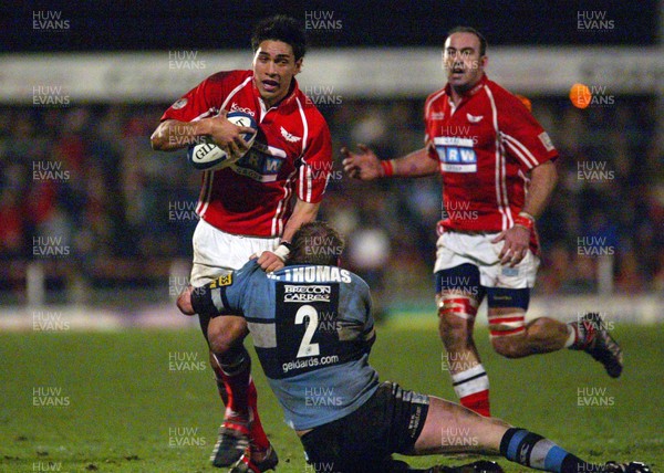 020106 - Llanelli Scarlets v Cardiff Blues - Celtic League -  Scarlets Regan King is tackled by Rhys Thomas