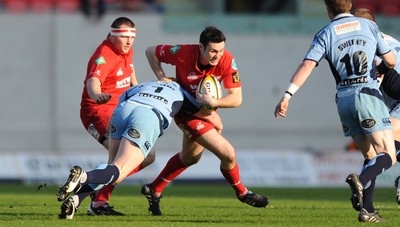 17.04.10 - Scarlets v Cardiff Blues - Magners League - Stephen Jones of Scarlets is tackled by Martyn Williams of Cardiff Blues. 