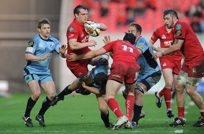 17.04.10 - Scarlets v Cardiff Blues - Magners League - Daniel Evans of Scarlets is tackled by Leigh Halfpenny of Cardiff Blues. 