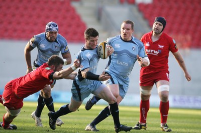 17.04.10 Scarlets v Blues... Blues Ceri Sweeney is tackled by Scarlets Dominic Day. 