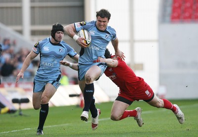 17.04.10 Scarlets v Blues... Blues Jamie Roberts is tackled by Scarlets Andy Fenby. 