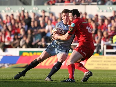 17.04.10 Scarlets v Blues... Blues Ceri Sweeney is tackled by Stephen Jones. 