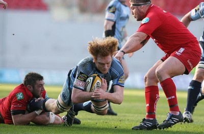 17.04.10 Scarlets v Blues... Blues Paul Tito is tackled by Scarlets Josh Turnbull and Rhys Thomas. 